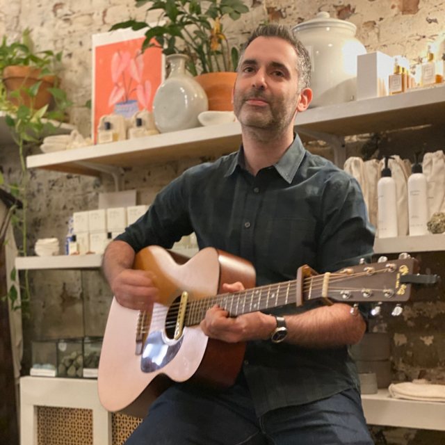 Playing acoustic guitar