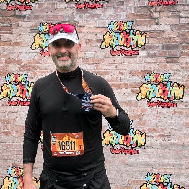 After the Brooklyn Half Marathon, with the medal